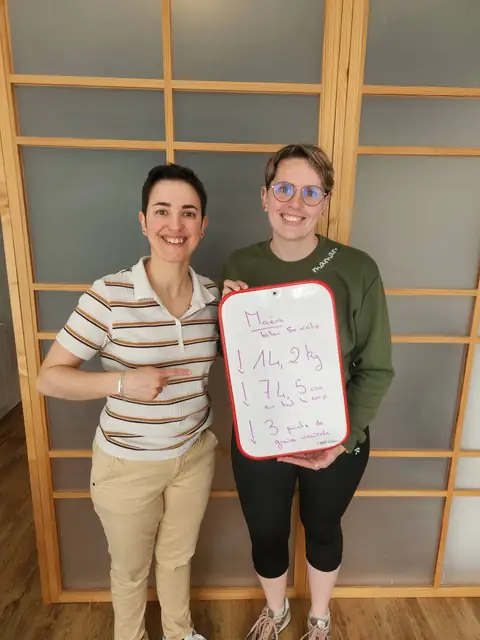 Chez Anjou Nutrition, une membre pose avec l’ardoise de son bilan