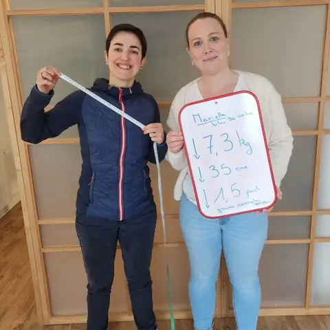Chez Anjou Nutrition, une membre pose avec l’ardoise de son bilan